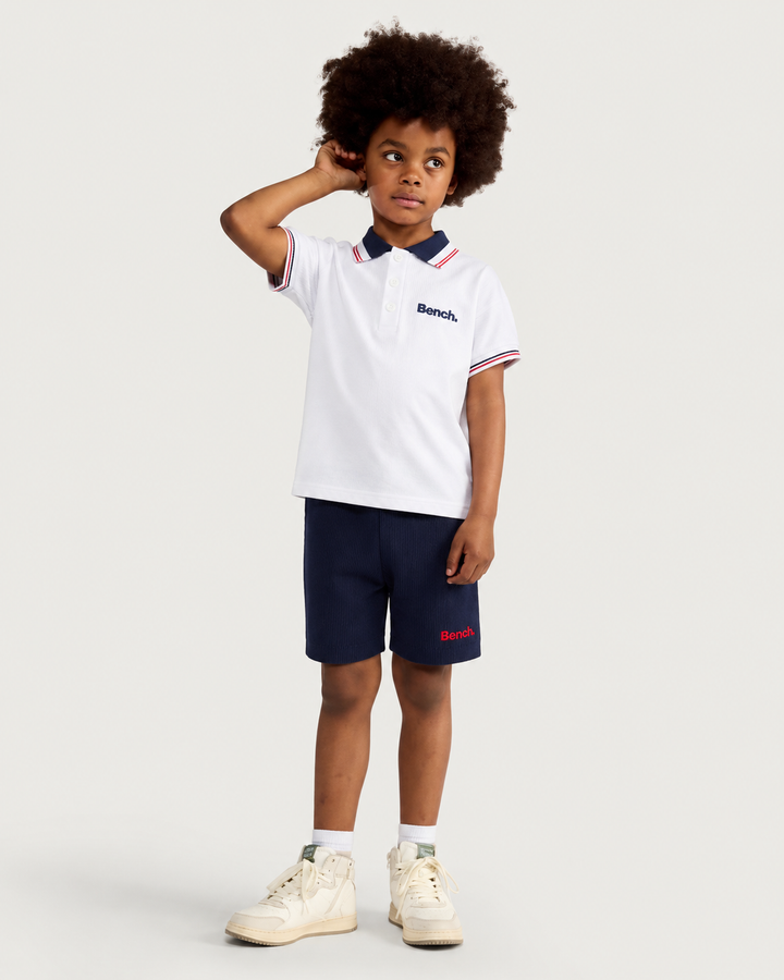 BENCH boys white knit polo and blue shorts